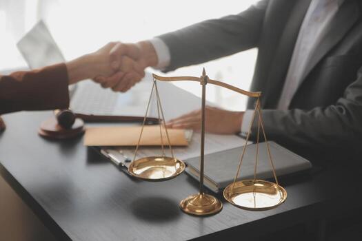 justice-and-law-concept-male-judge-in-a-courtroom-with-the-gavel-working-with-computer-and-docking-keyboard-eyeglasses-on-table-in-morning-light-photo